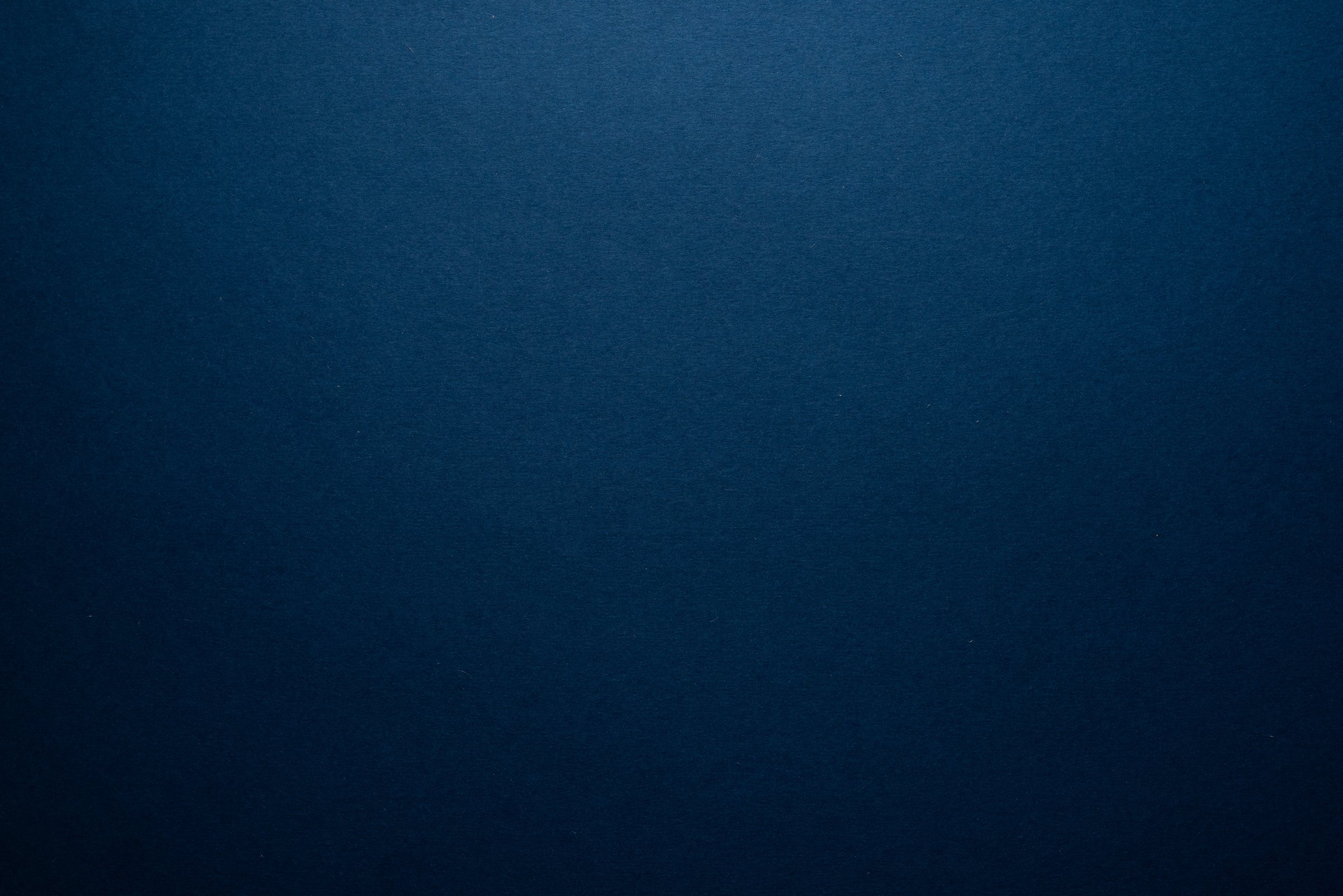 Empty dark blue background.